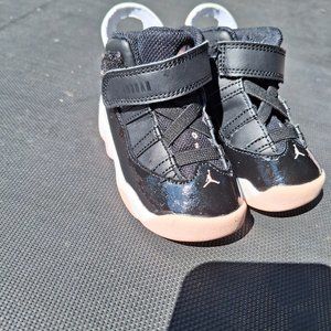 Pink and black jordan toddler sneakers